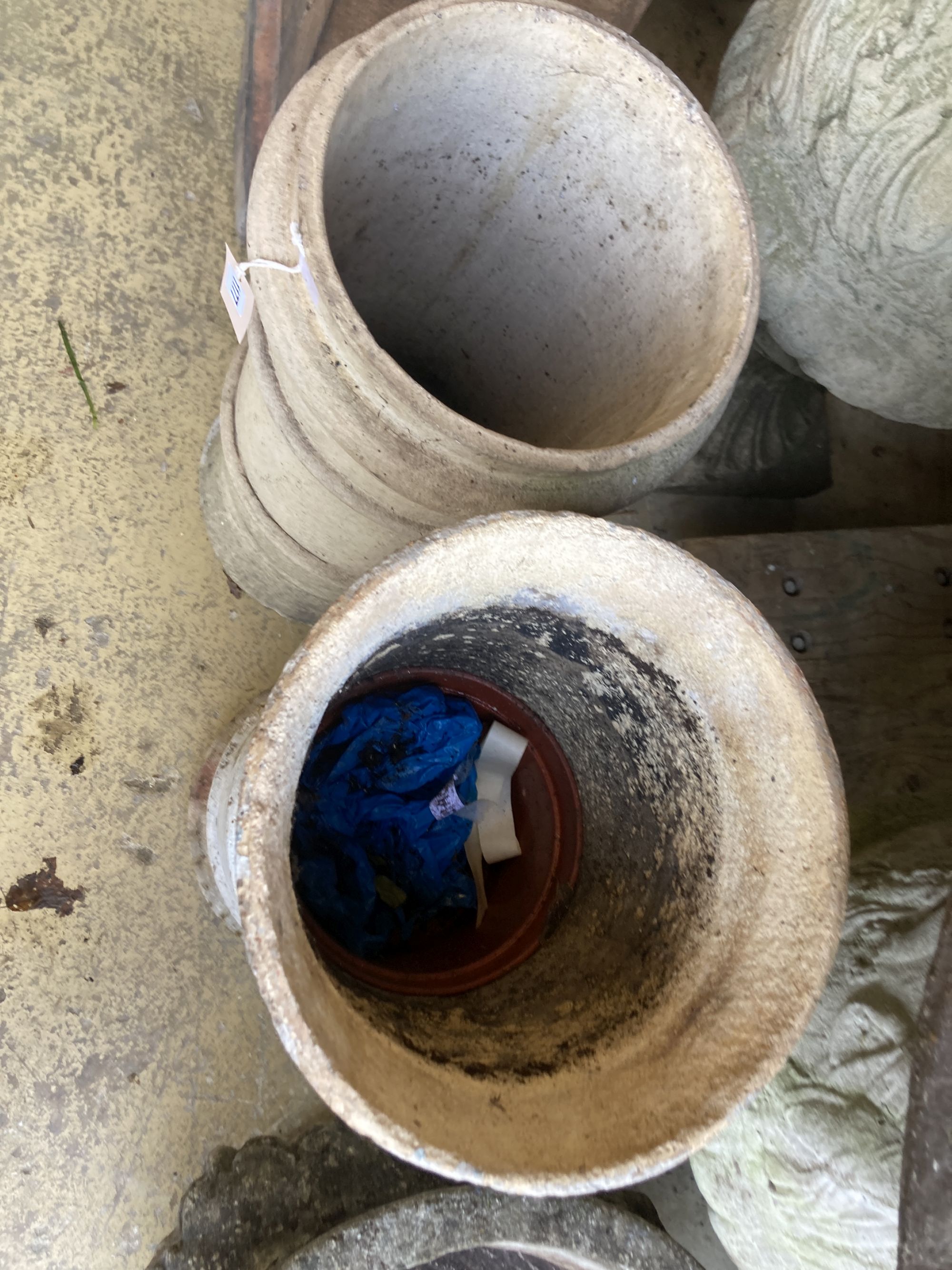 Two glazed earthenware chimney pots, larger 62cm high